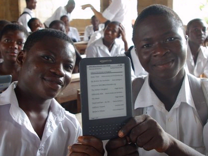 Two boys in Ghana Africa with WorldReader Amazon Kindle